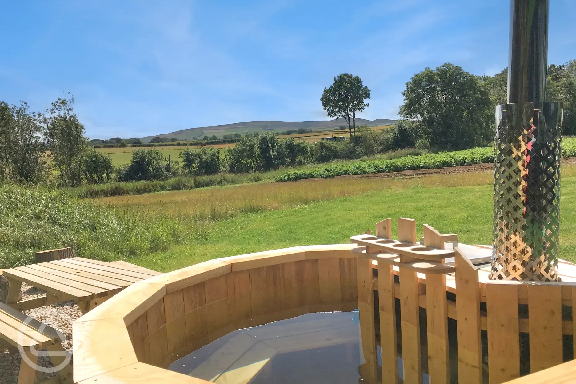 Eco bus wood-fired hot tubs with Lammermuir Hills views and seating