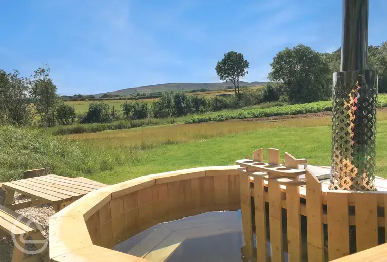 Eco bus wood-fired hot tubs with Lammermuir Hills views and seating