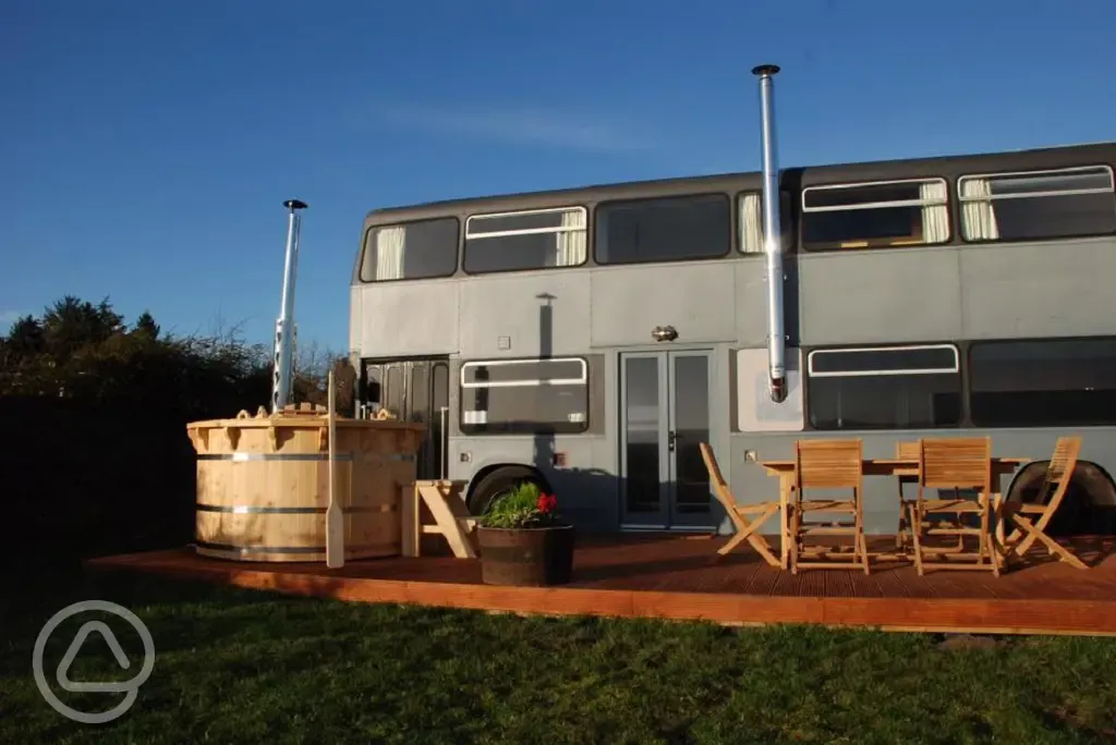 Luxury glamping bus (six person) at night