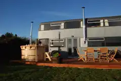 Luxury glamping bus (six person) at night