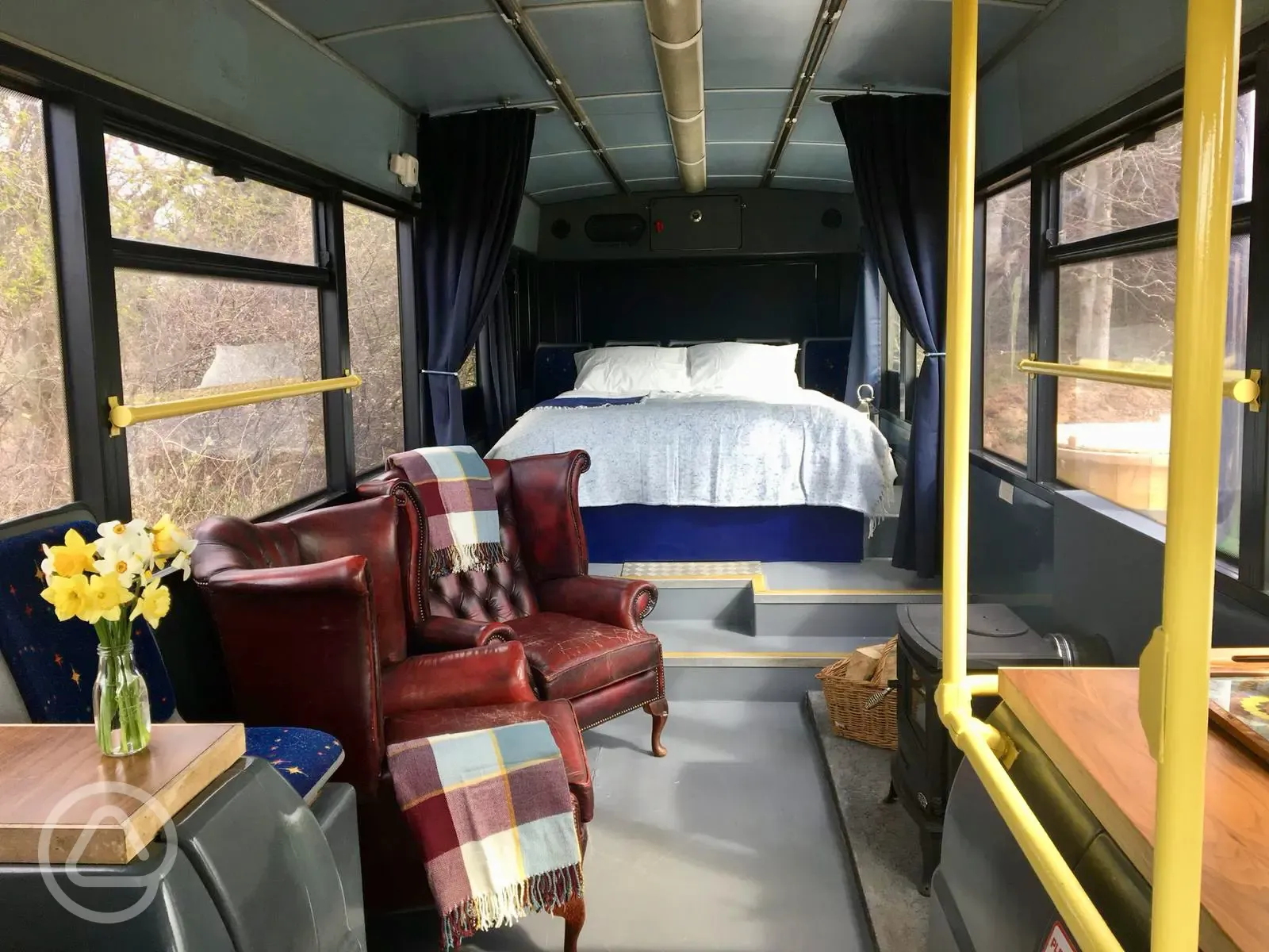 Eco bus (two person) interior with a king size bed and bedding provided