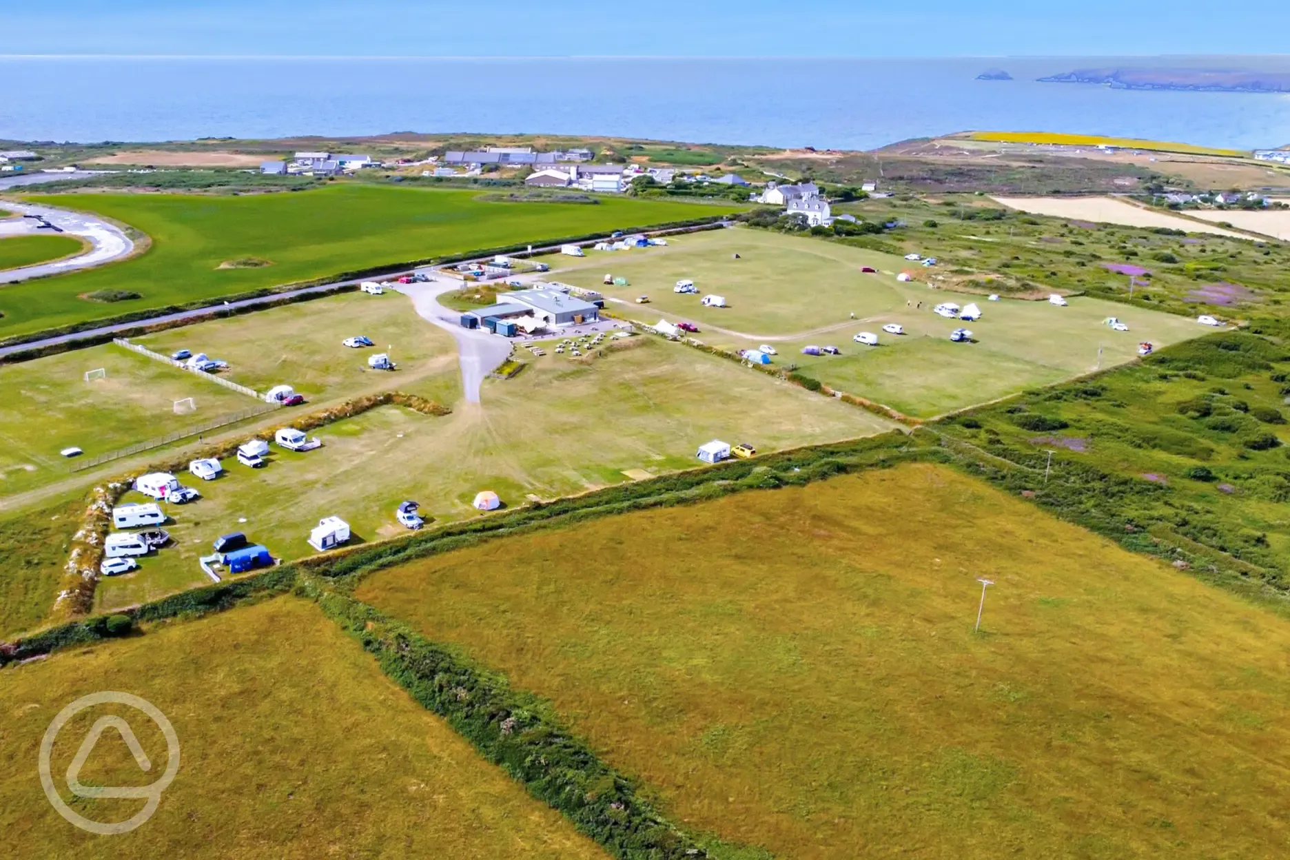 Aerial of Anchor Barrow Campsite with views to Perranporth and the coast