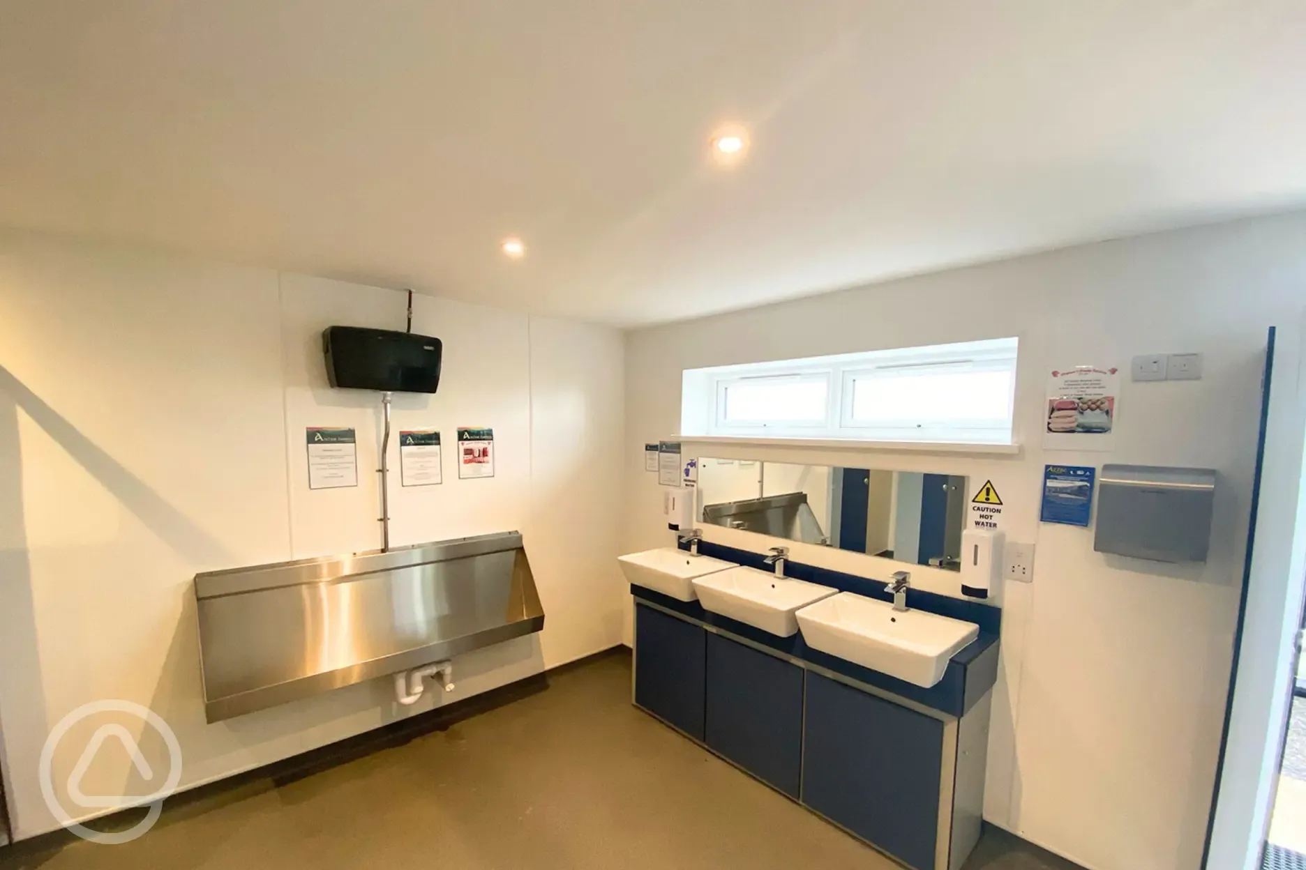 Men's toilets with cubicles and urinals