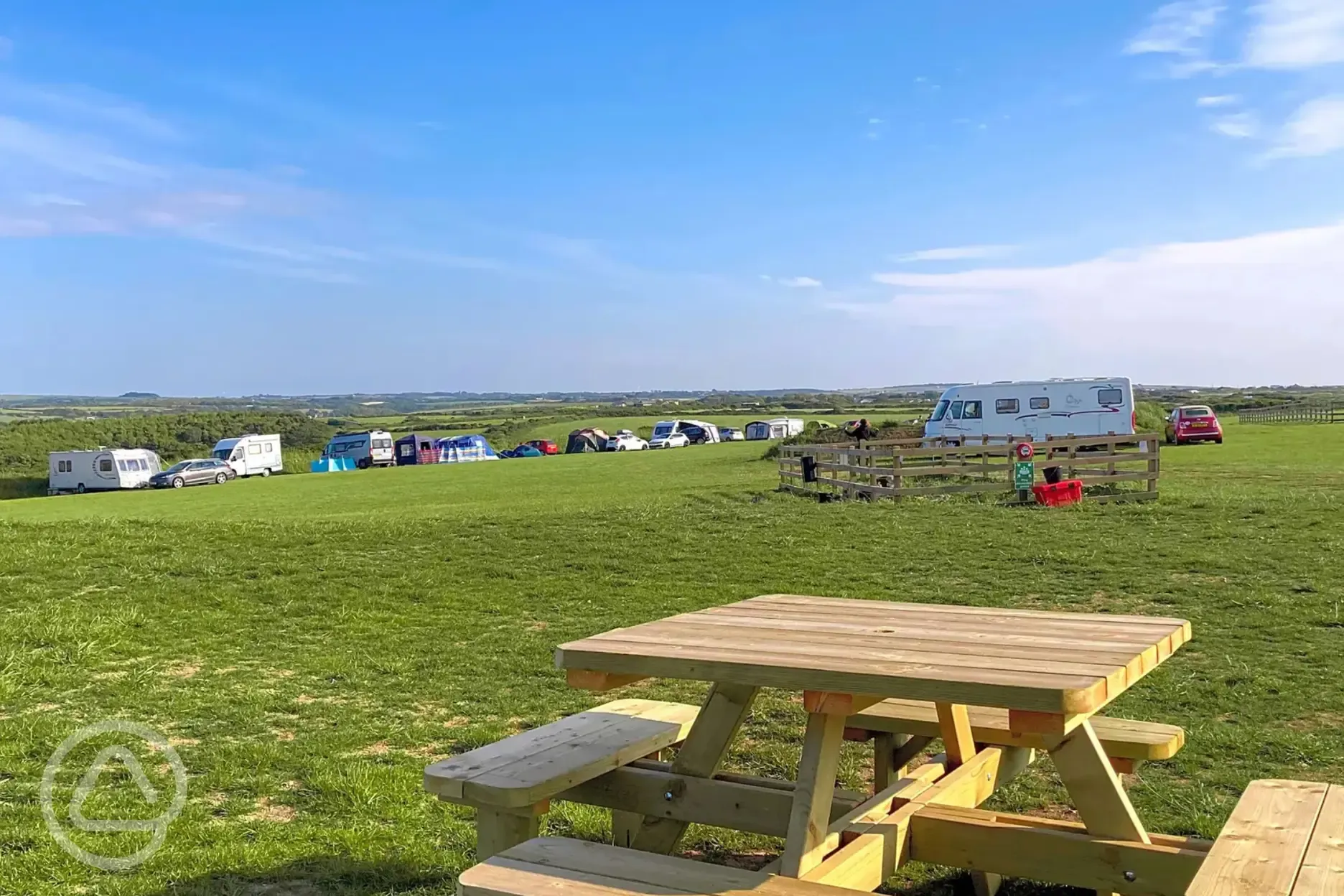 Grass pitches with picnic bench seating