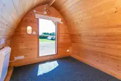 Camping pod interior with heating and plug sockets