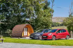 Camping pods with parking spaces