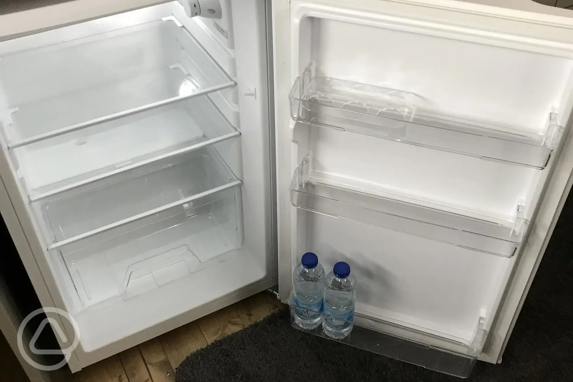 Full size fridge with complimentary water milk.