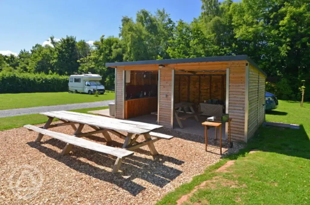 Undercover washing up area and communal fridge