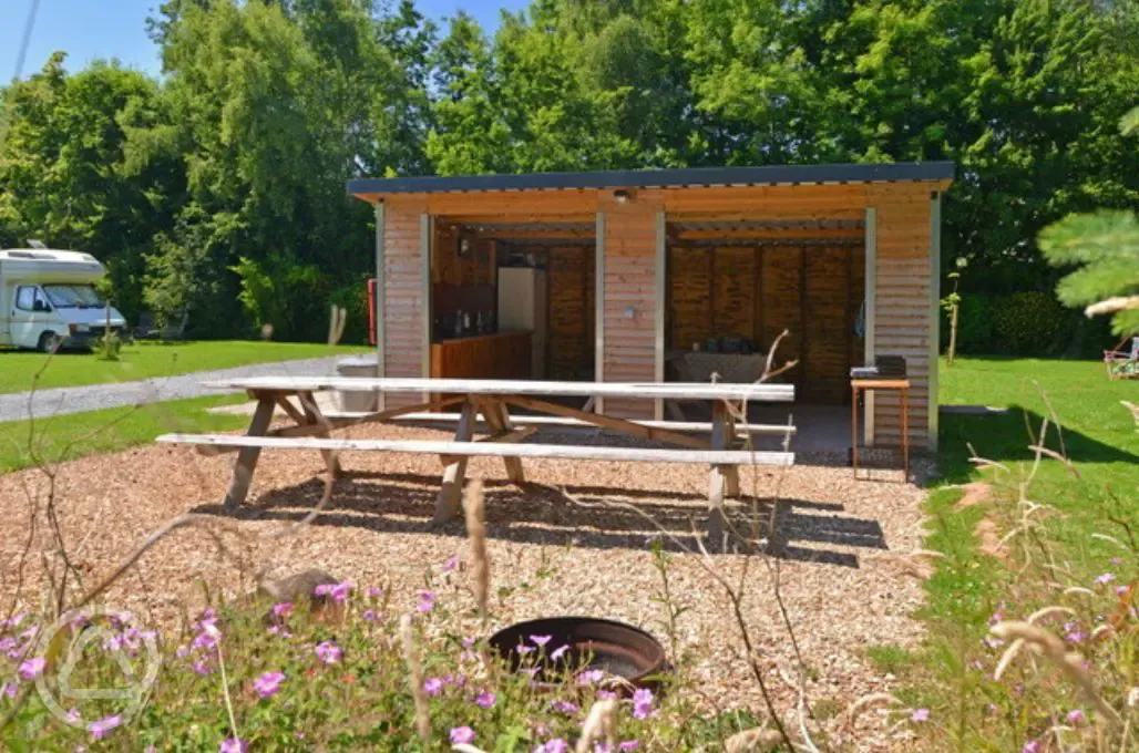 Undercover washing up area and communal fridge