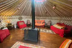  Robin Roundhouse yurt - interior with three double beds and two single futons