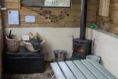 Swan Lakeview - dining hut with a picnic bench and fire place