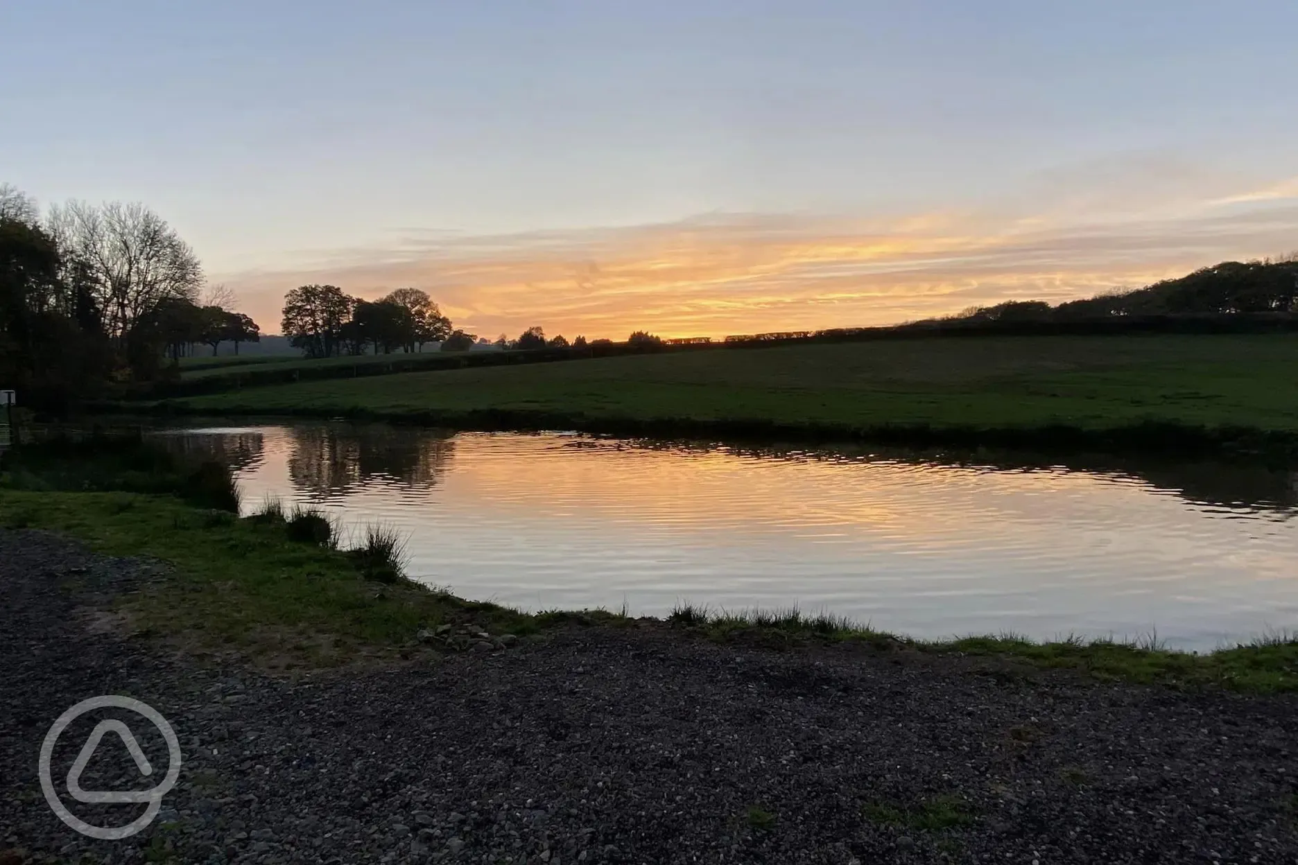 Fly fishing lake at sunset