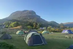 Grass tent pitches (optional electric) with loch views Grass tent pitches (optional electric) with loch views