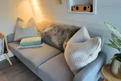 Sildvik and Sunset ensuite glamping pod interiors with a sofa