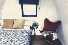 Sea Eagle glamping pod interior with a double bed