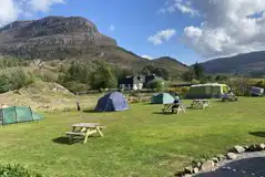 Grass tent pitches (optional electric) with loch views Grass tent pitches (optional electric) with loch views