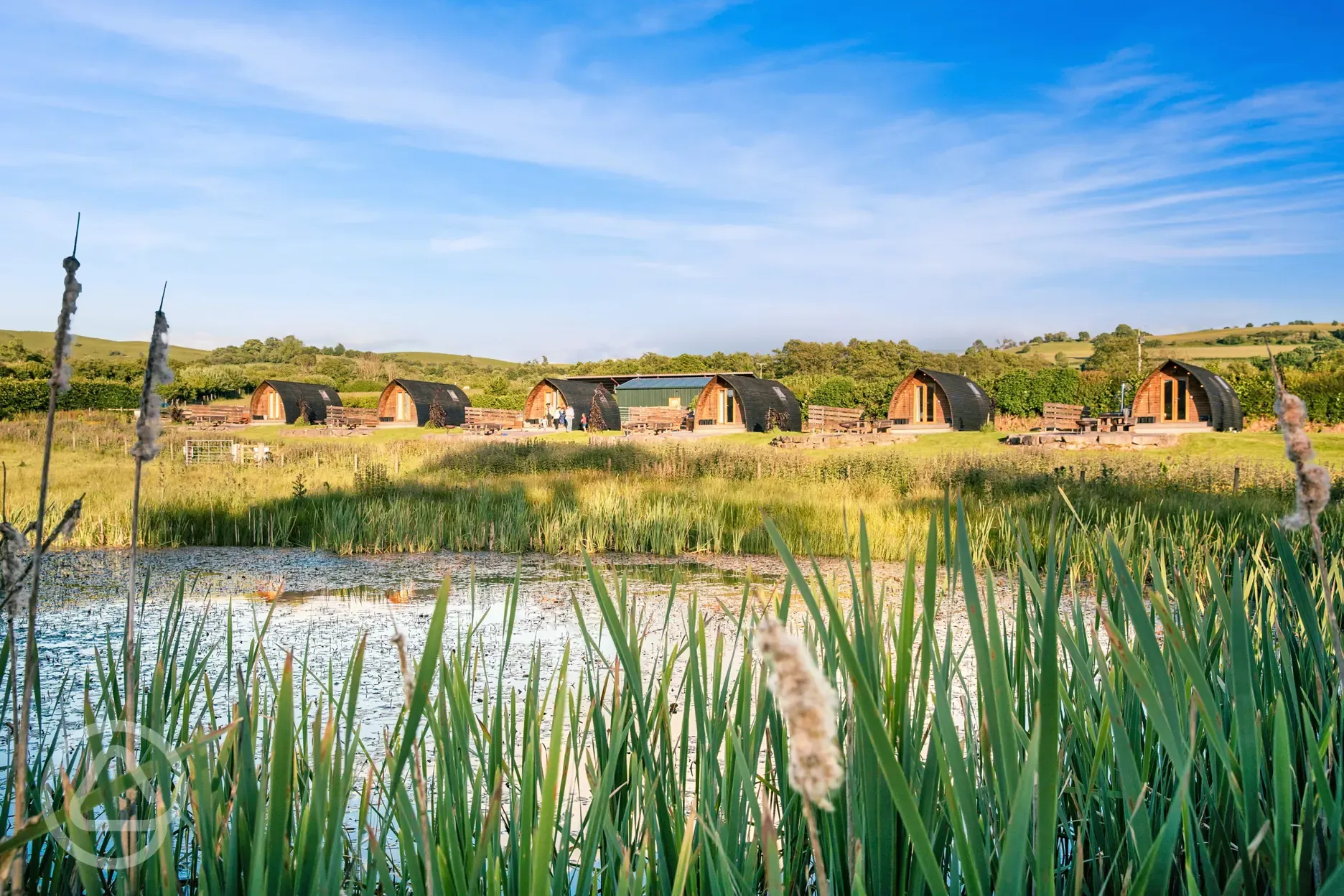 Deluxe Wigwam pods by the lake