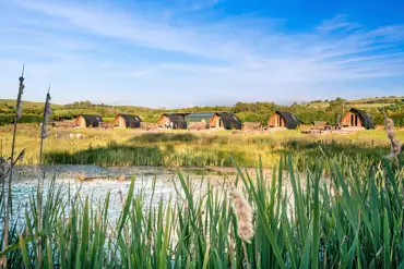 Deluxe Wigwam pods by the lake