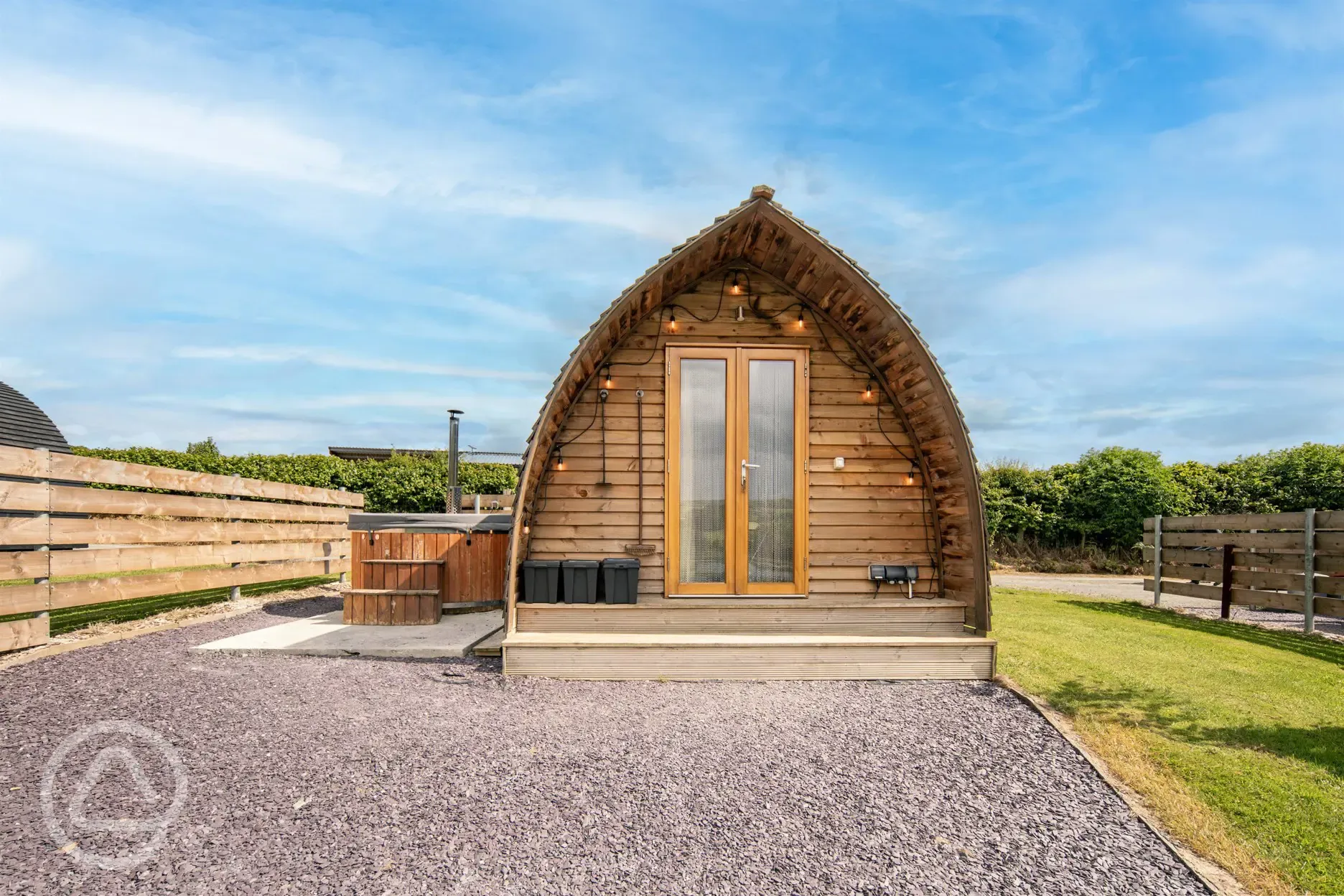 Ensuite deluxe Wigwam pod with a hot tub