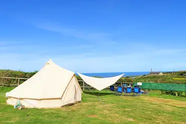 Bell tent pitched on a sea view non electric grass pitch