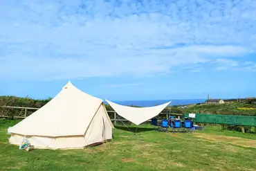 Bell tent pitched on a sea view non electric grass pitch