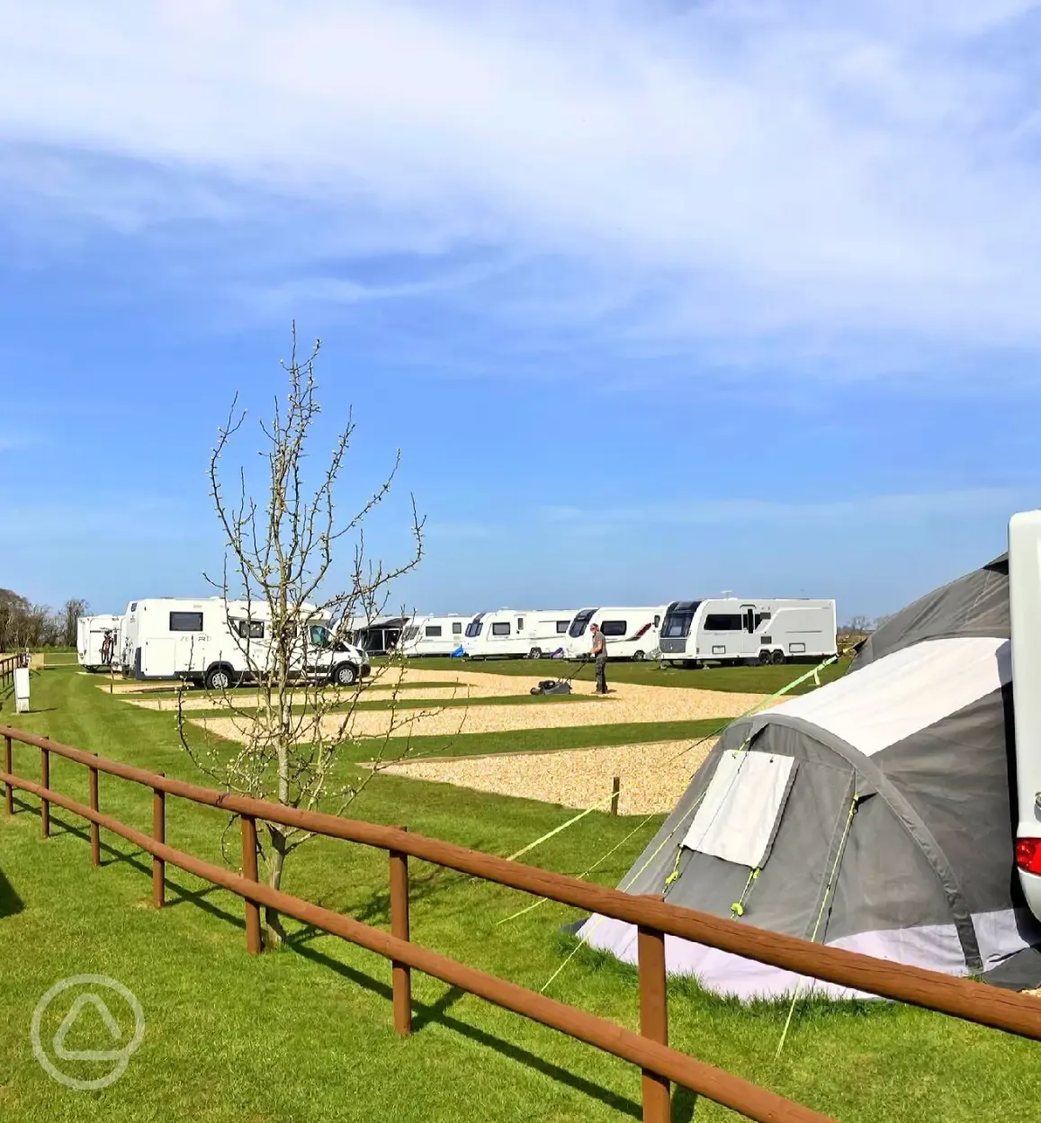 Hardstanding touring pitches with small fences to divide areas