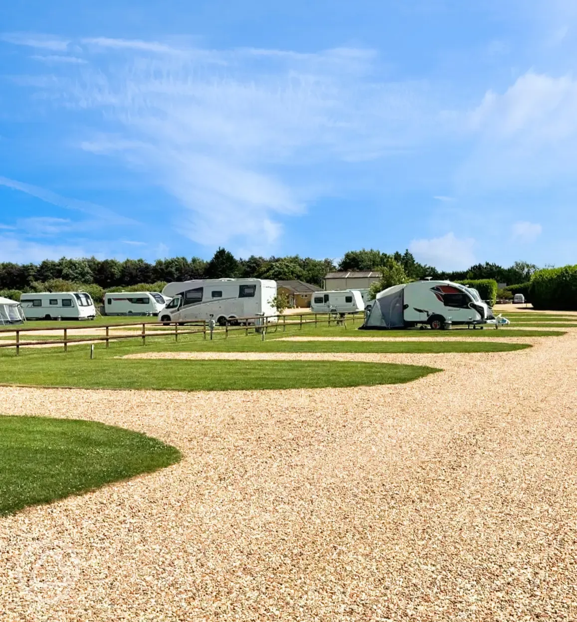 Hardstanding touring pitches with grass areas between