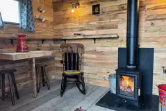 Shepherd's hut interior with a log burner Shepherd's hut interior with a log burner