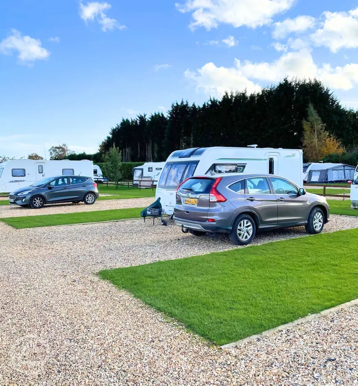 Hardstanding touring pitches with grass areas between