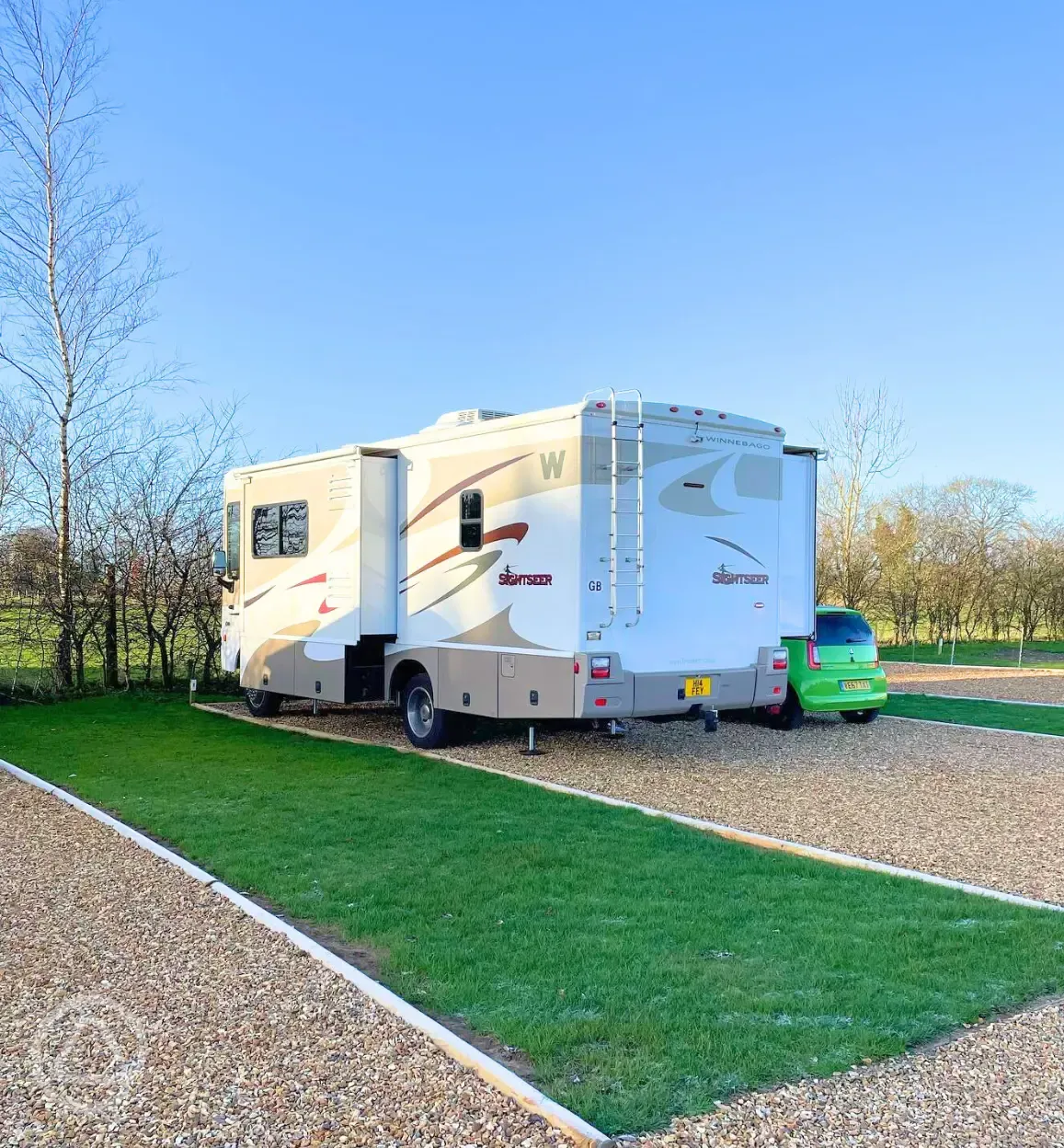 Hardstanding touring pitches with grass areas between