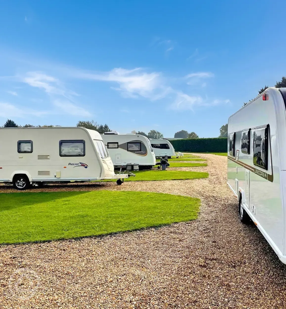 Hardstanding touring pitches with grass areas between