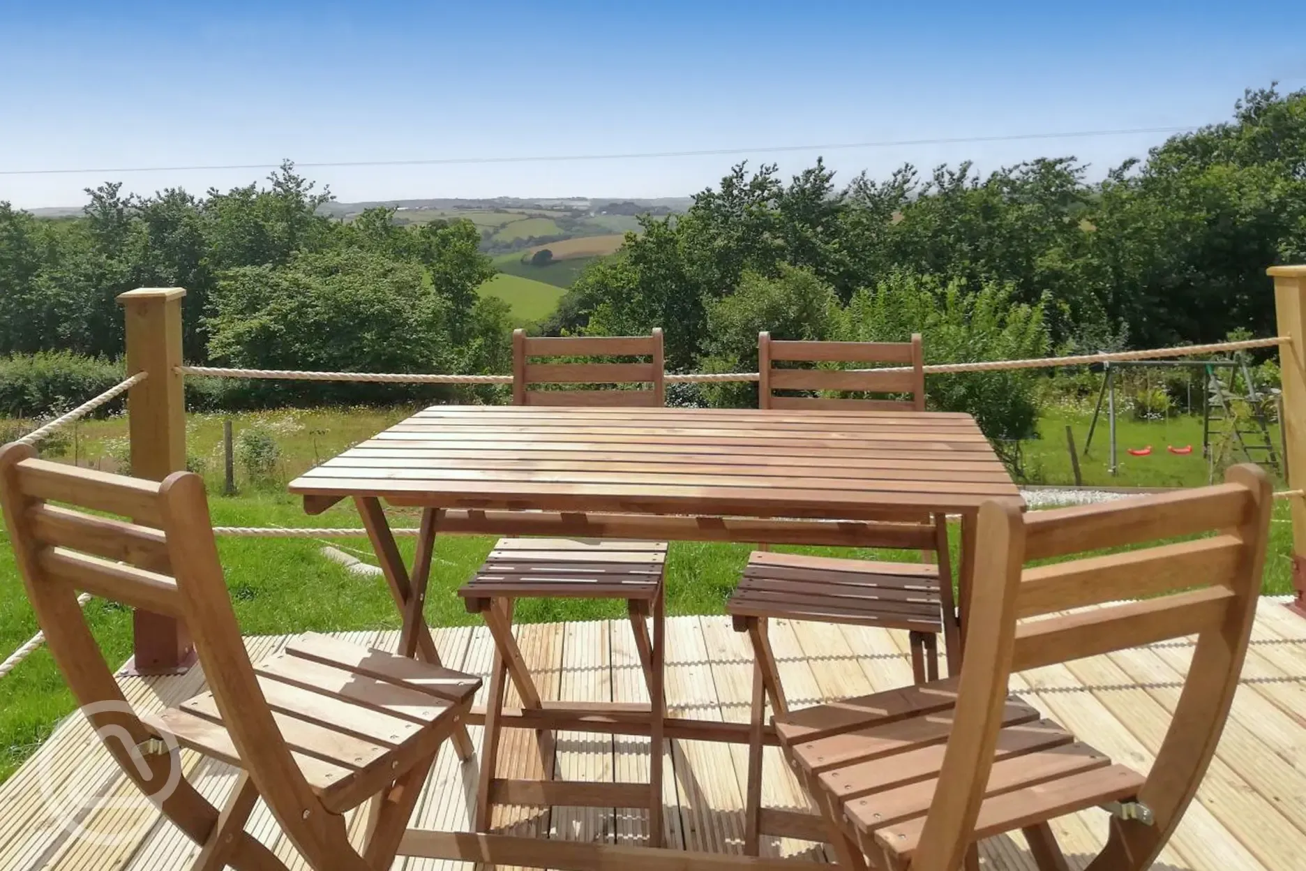 Outdoor seating on the decking with countryside views