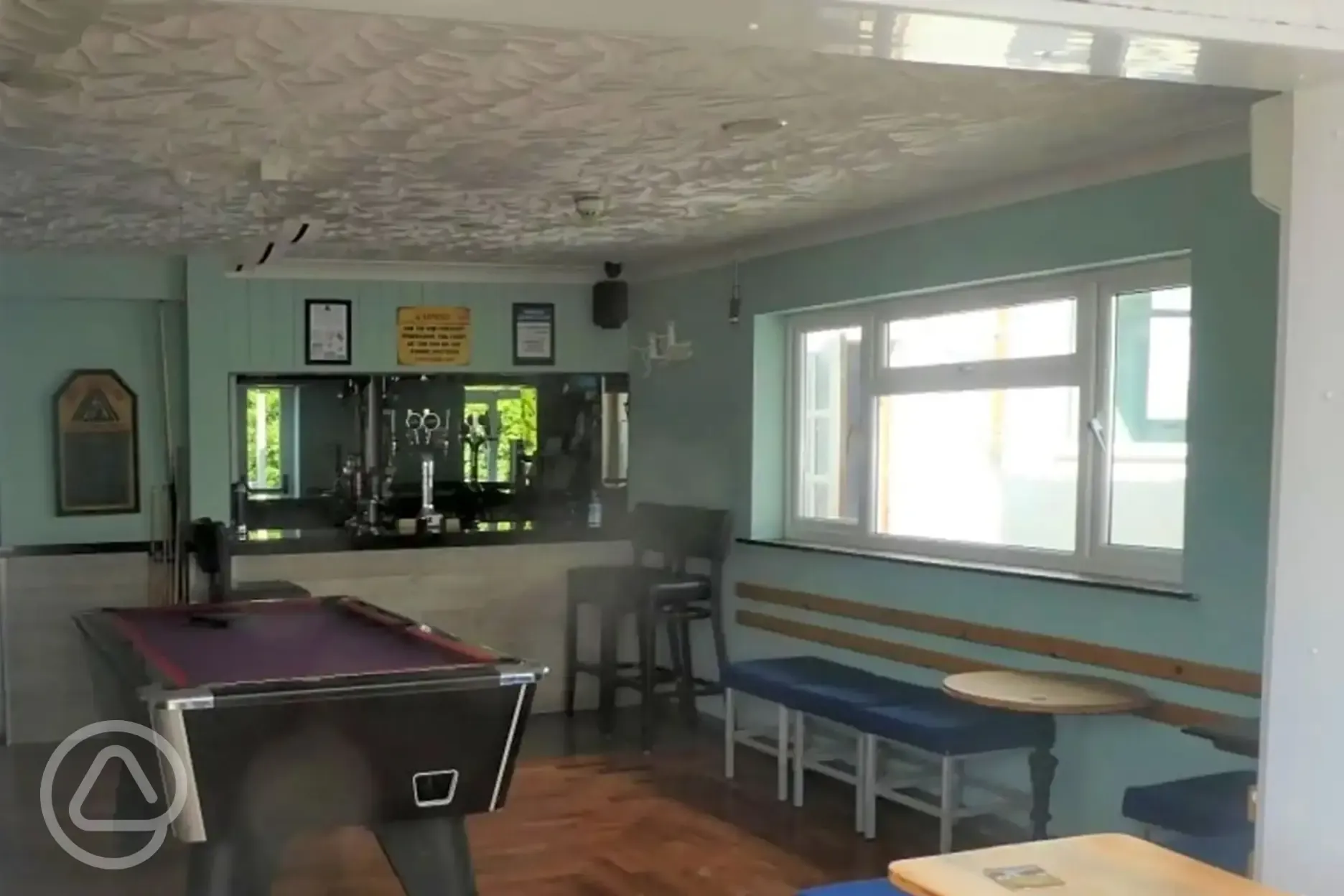 Pool table and bar area in the pub
