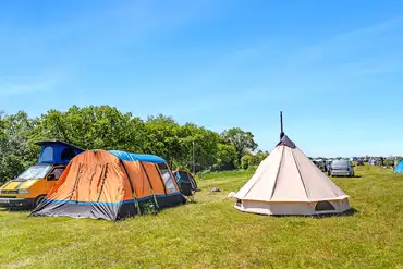 Tents on non electric grass pitches at Basecamp at Mendip Activity Centre