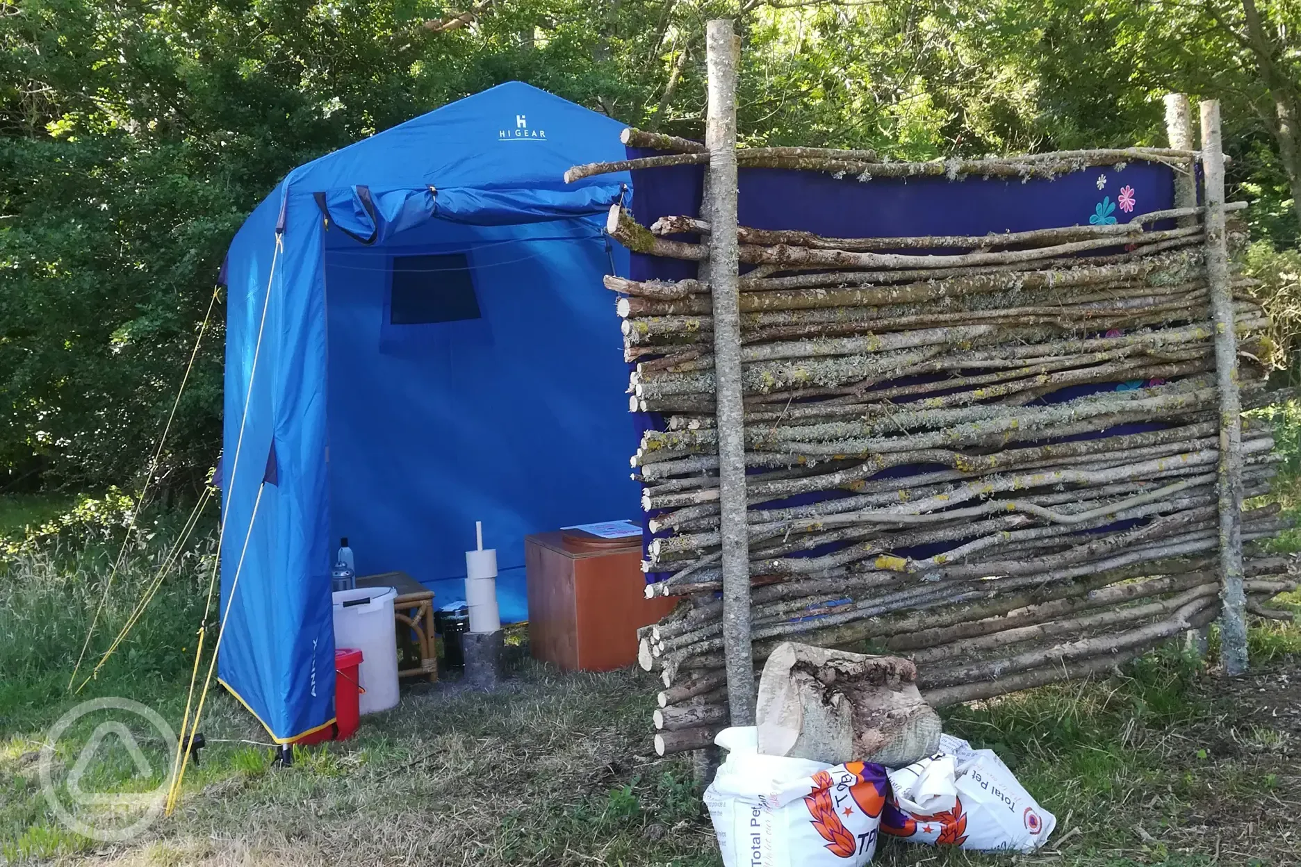 Eco toilet in blue utility tent