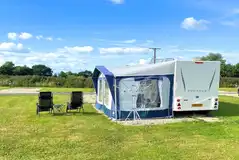 Fully serviced hardstanding touring pitches with space for an awning