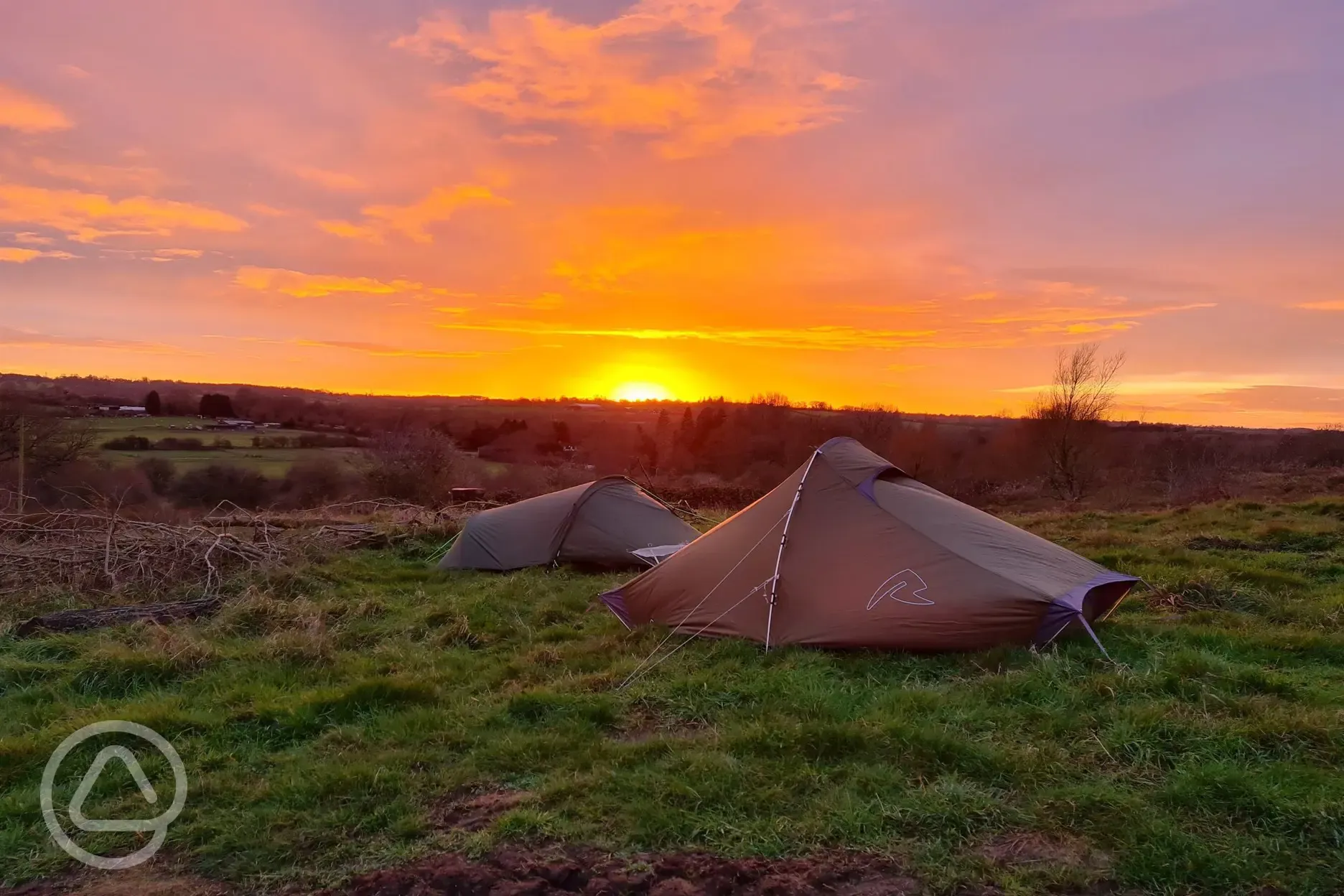 Camping on the hill at sunset
