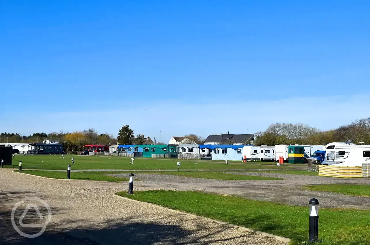 Electric hardstanding and grass pitches