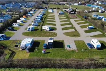 Aerial view of electric hardstanding and grass pitches