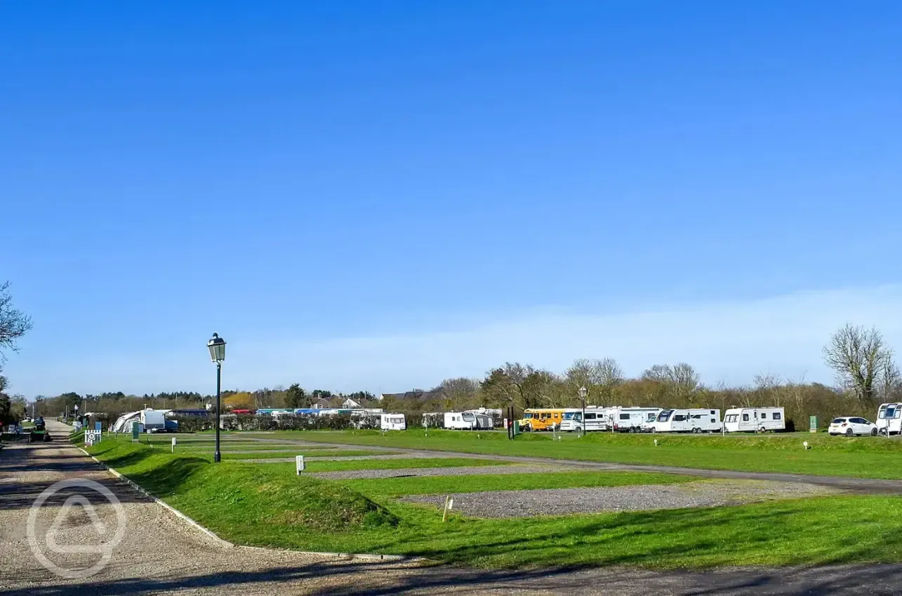 Electric hardstanding and grass pitches measuring 10m by 10m