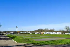 Electric hardstanding and grass pitches measuring 10m by 10m Electric hardstanding and grass pitches measuring 10m by 10m