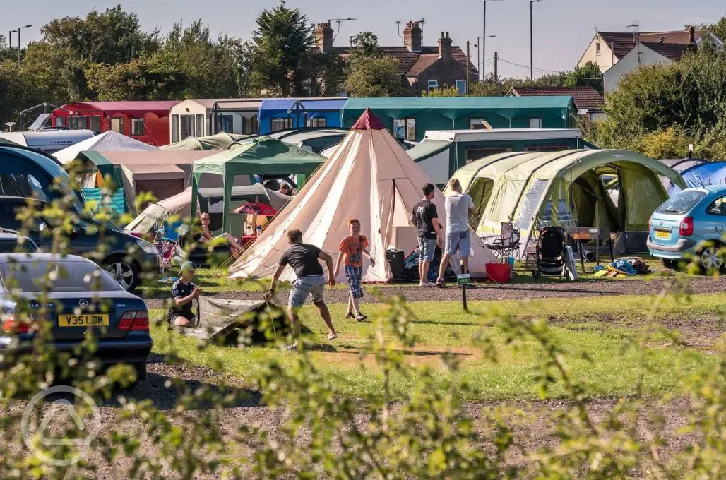 Electric hardstanding and grass pitches