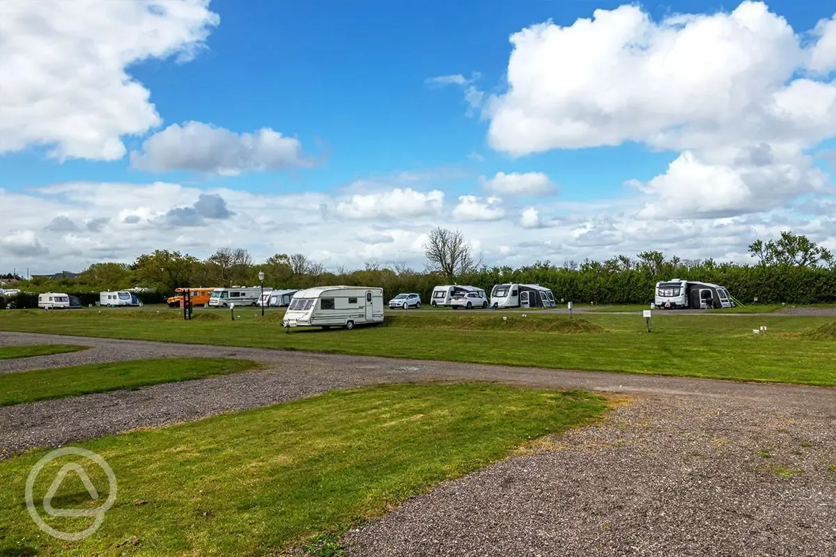 Electric hardstanding and grass pitches