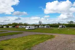 Electric hardstanding and grass pitches