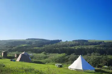 Bell tents and grass pitches
