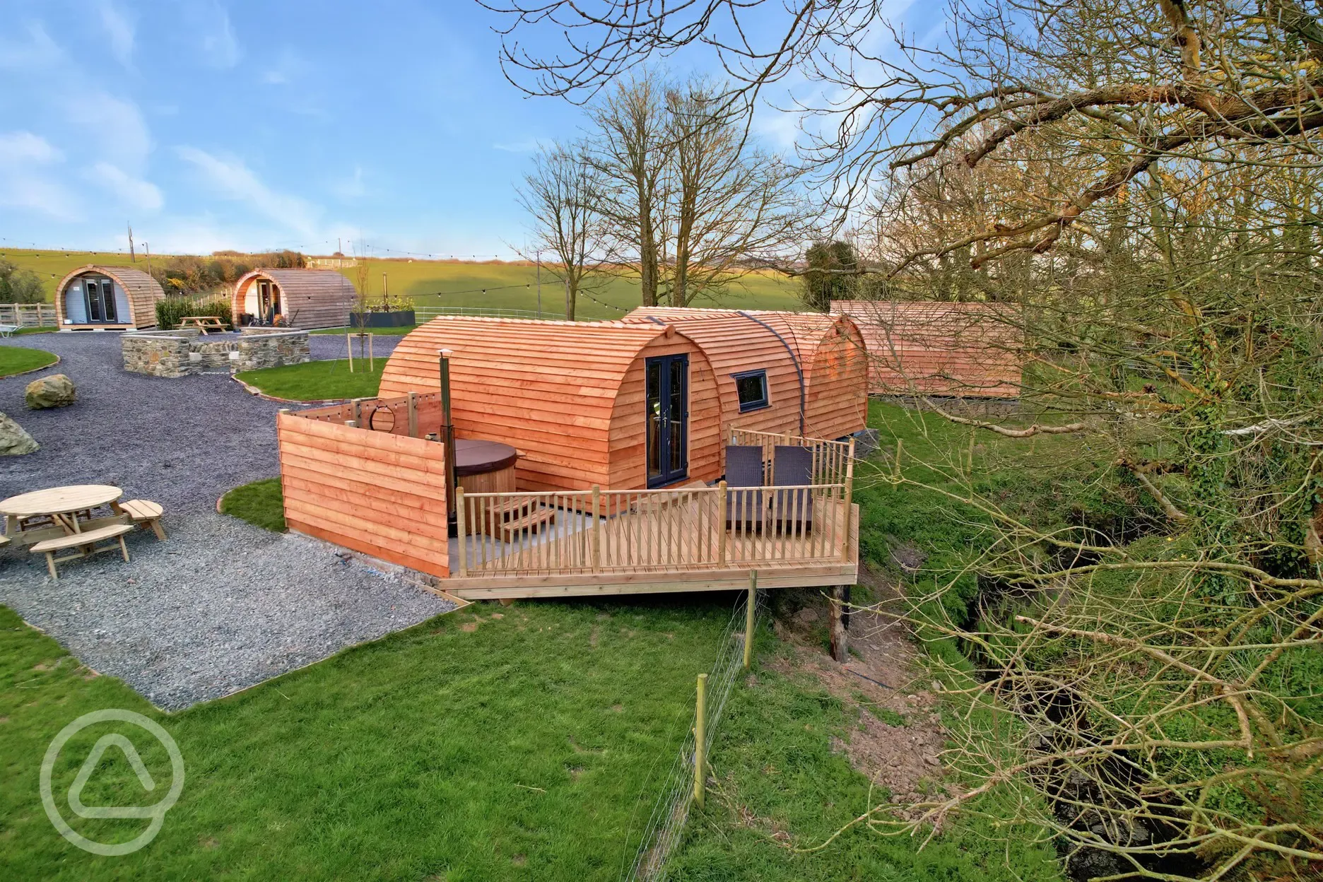 Llys y Llwynogod pod (sleeping five) with a sheltered wood-fired hot tub
