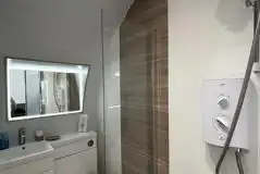 Glamping pod ensuite wetroom bathroom with an electric shower