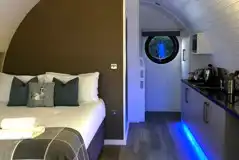 Glamping pod interior with strip LED lighting