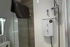 Glamping pod ensuite wetroom bathroom with an electric shower