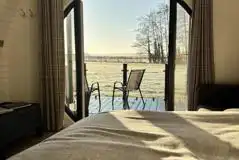 Glamping pod countryside views through double glass doors